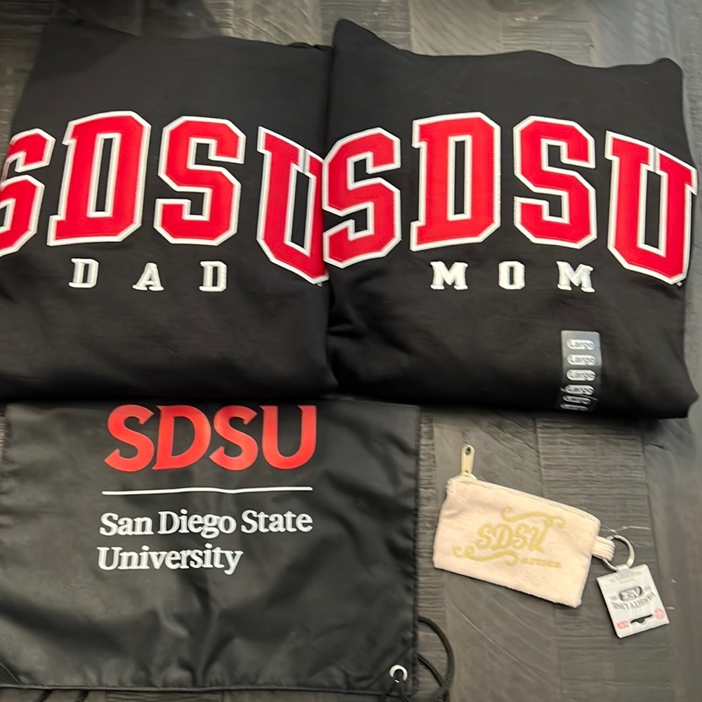 SDSU parent swag sweatshirts and pull bag and keychain bag
